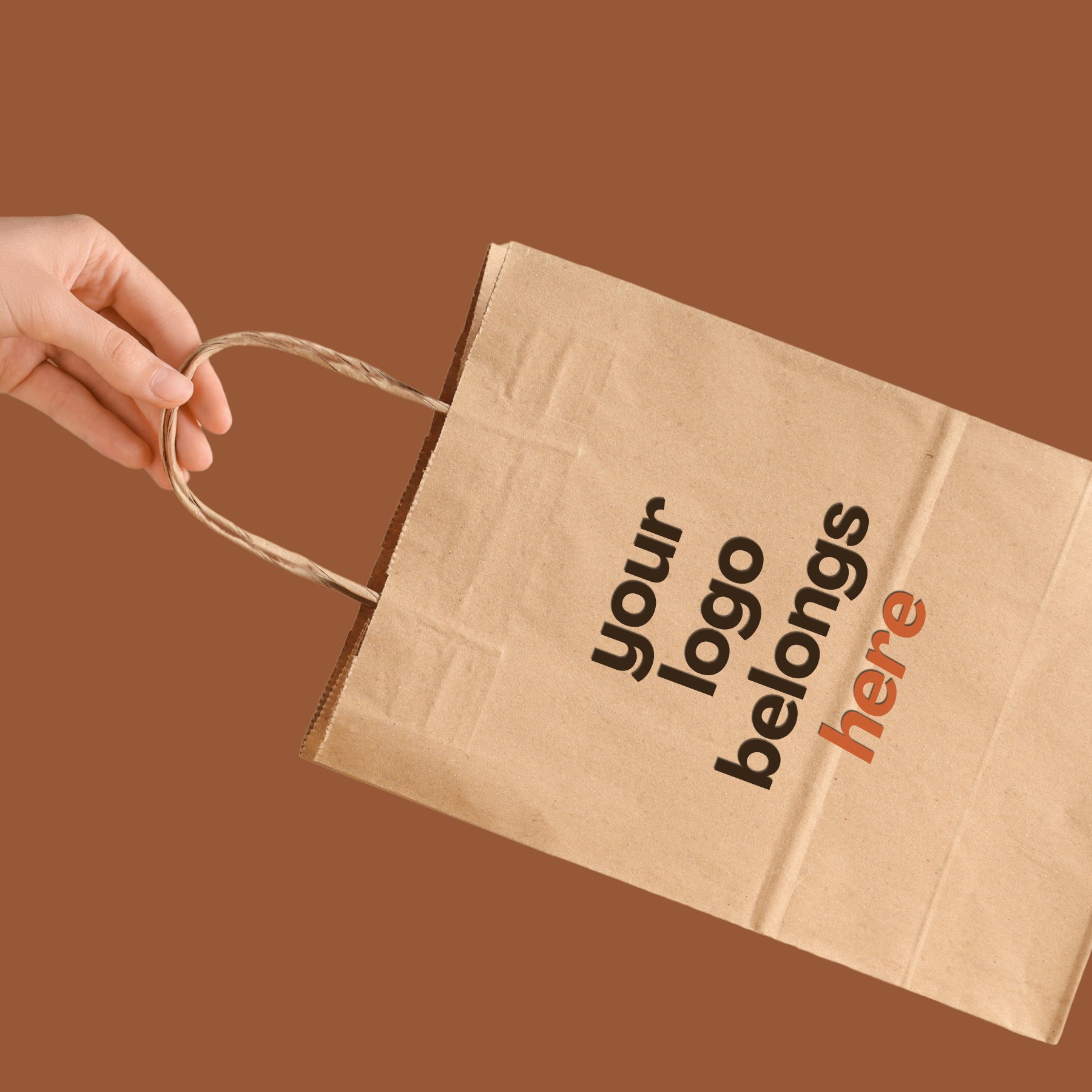 A kraft paper bag printed with the message 'your logo belongs here'